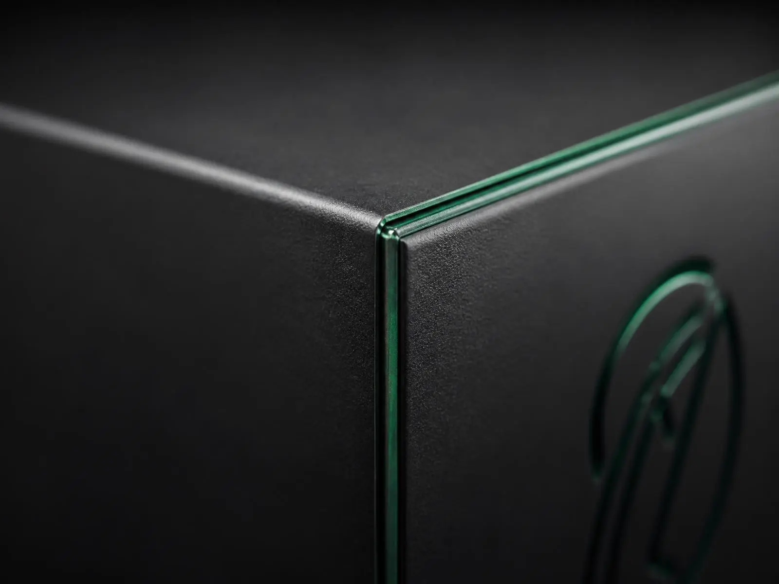 Macro view of a matte branded box with debossed logo and foil edge detail